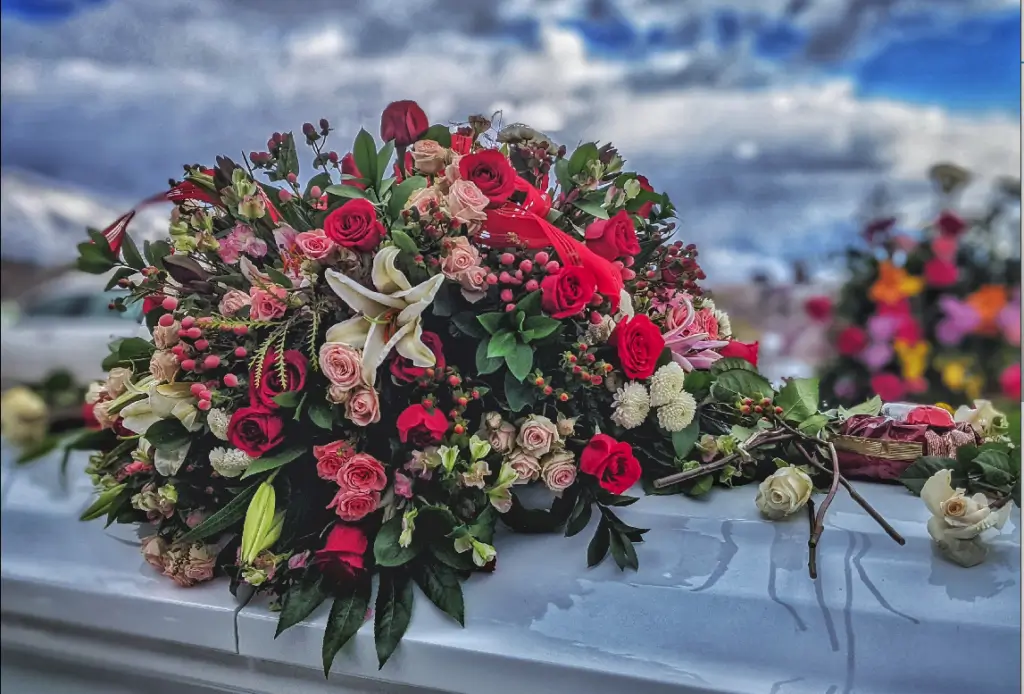 large rose and lily casket arrangement