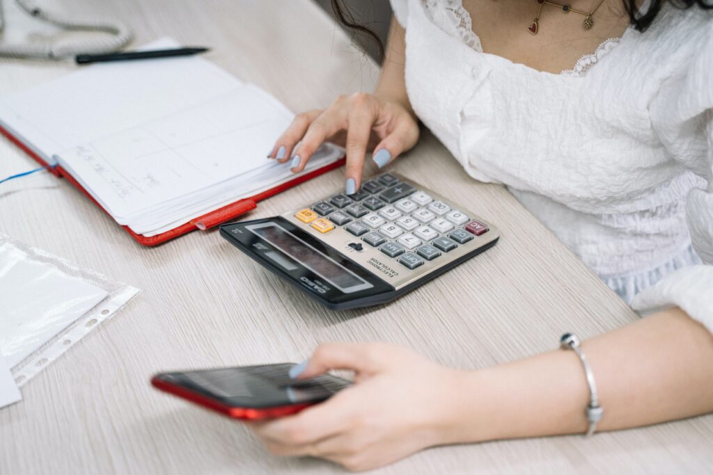 a lady computing finances using a calculator