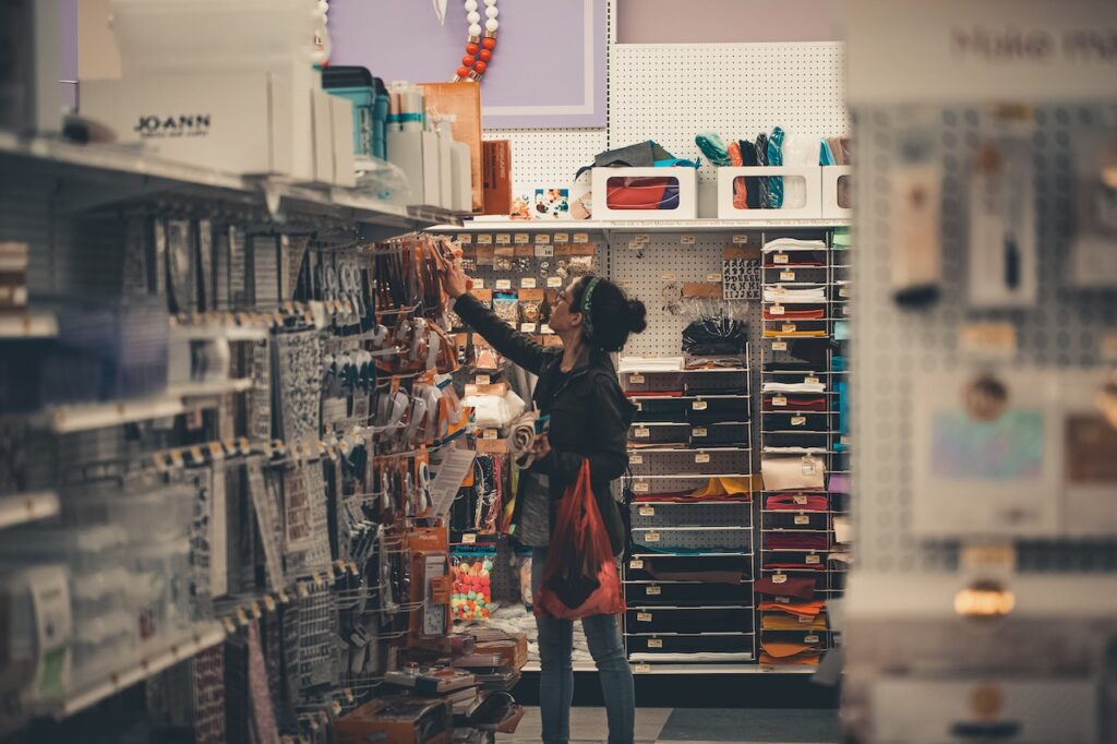a woman shopping for supplies at a hardware store